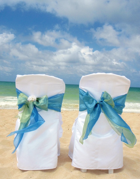 http://www.adreamweddinghawaii.com/sky%20&%20ocean%20double%20organza%20sash%20on%20covered%20chair.JPG